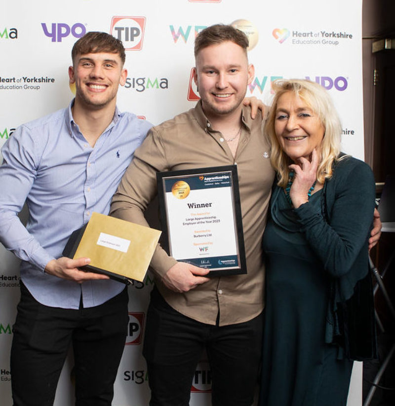 Callum Brooke (left) and Chad Wain (middle) collecting their award from Clare Hunt, Enterprise Manager at Wakefield First