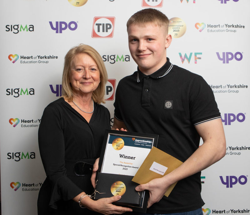Sam Wright, Principal and Chief Executive at the Heart of Yorkshire Education (left) presenting Lucas Moon with his award (right)