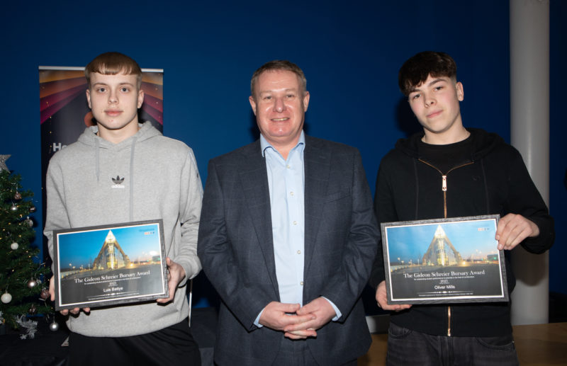 Alistair Mc Loughlin from Waystone middle with Luis Battye left and Oliver Mills right